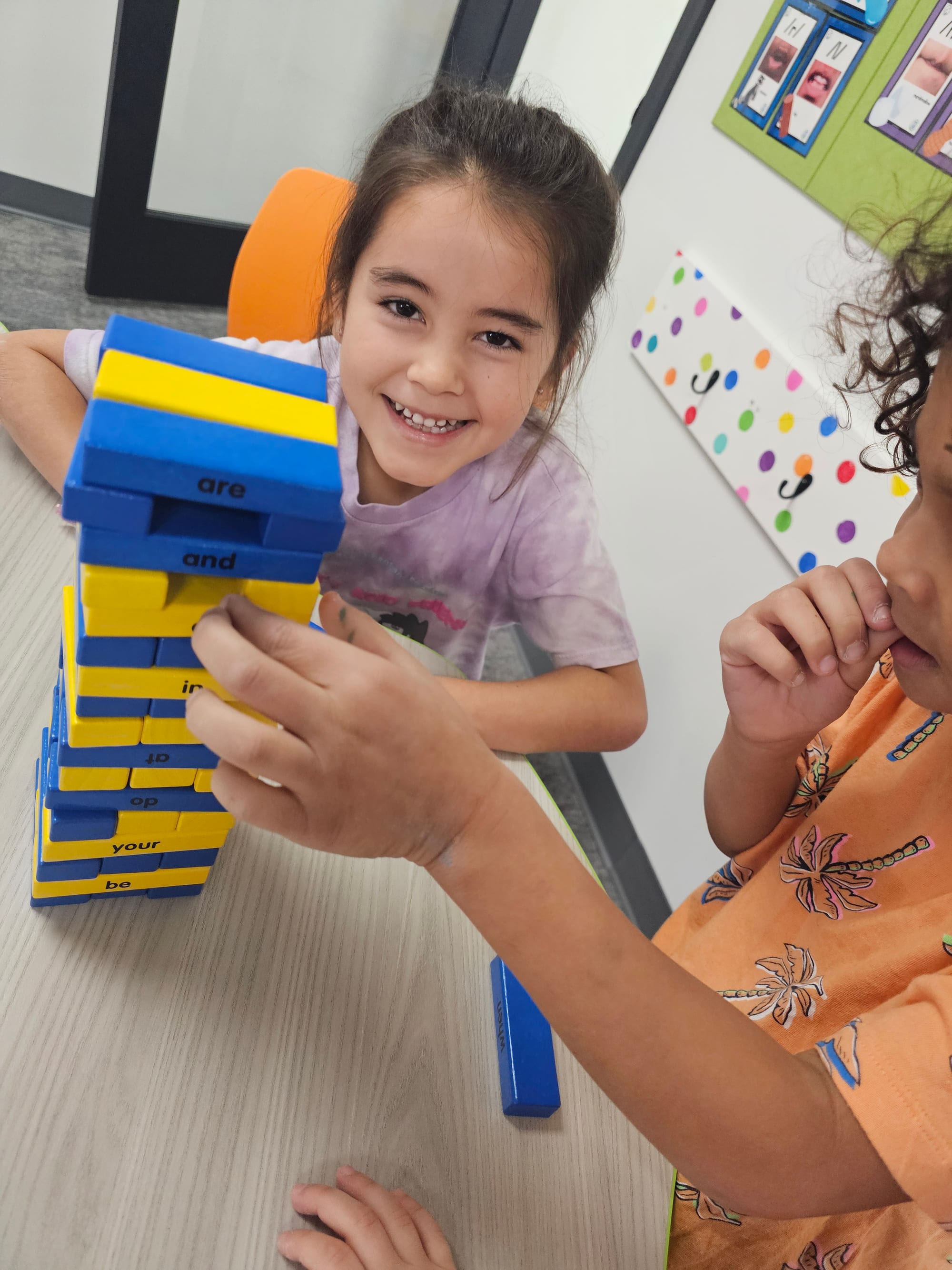 Student practicing reading with letter block phonics